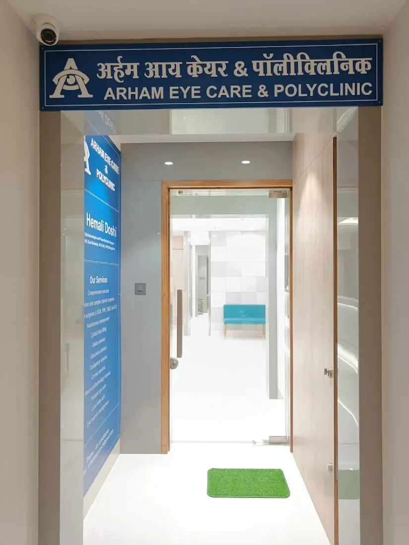 Entrance of Arham Eye Care & Polyclinic with the blue bilingual signboard (Hindi and English) above the doorway, Pant Nagar, Ghatkopar East, Mumbai
